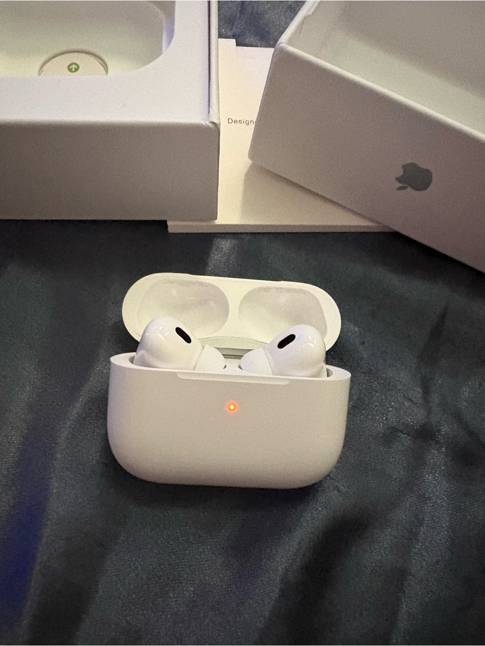 Apple White Wireless Earbuds with White Charging Case and Orange LED Indicator